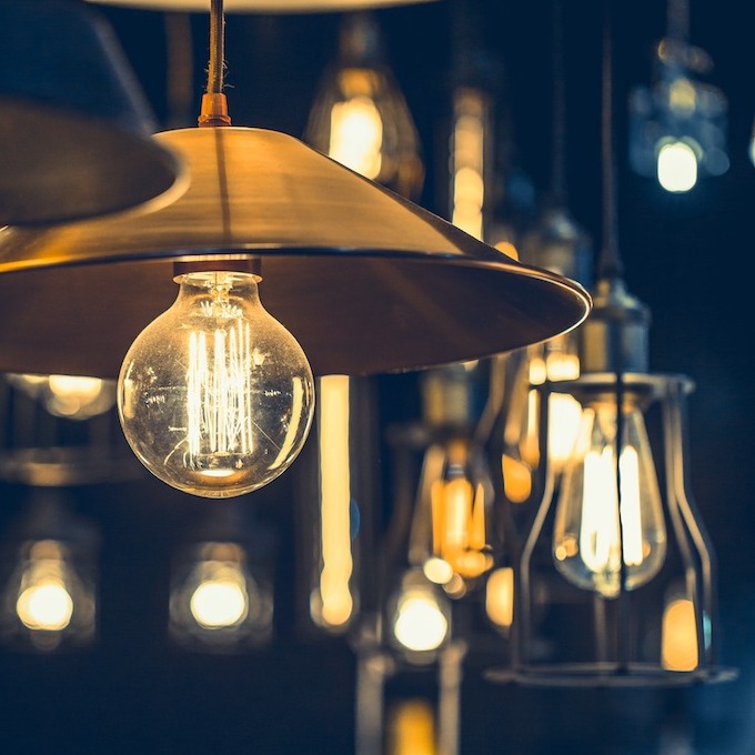 A selection of different electrical lighting fixtures with a dark background for contrast.