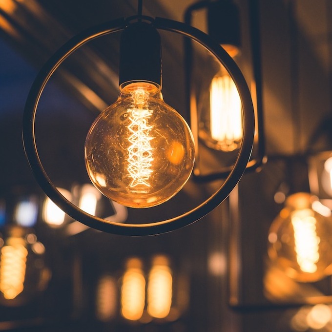 New, updated lighting seen through new commercial lighting fixtures with a dark and moody background